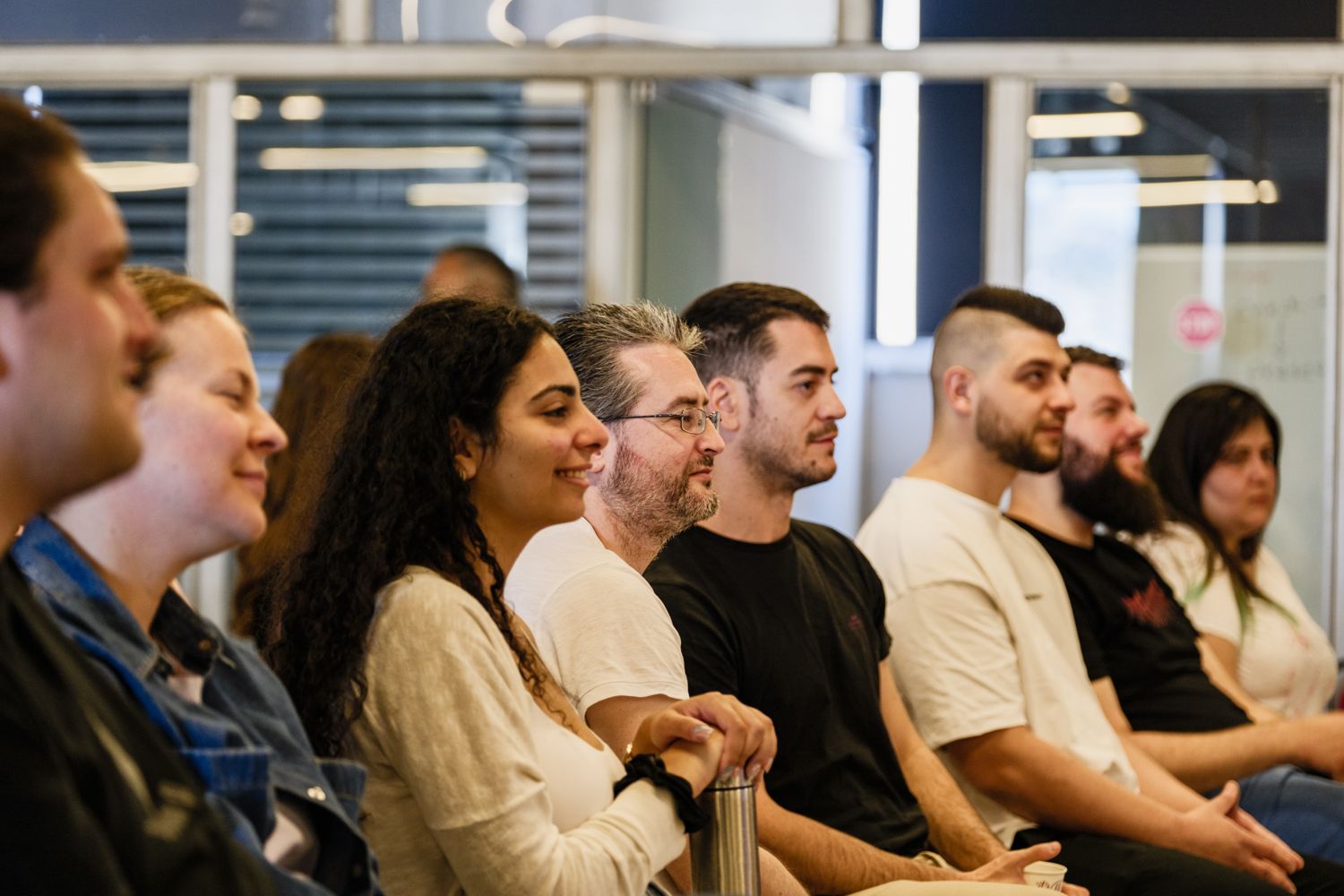 A cohort learning together in a room on the A³ campus