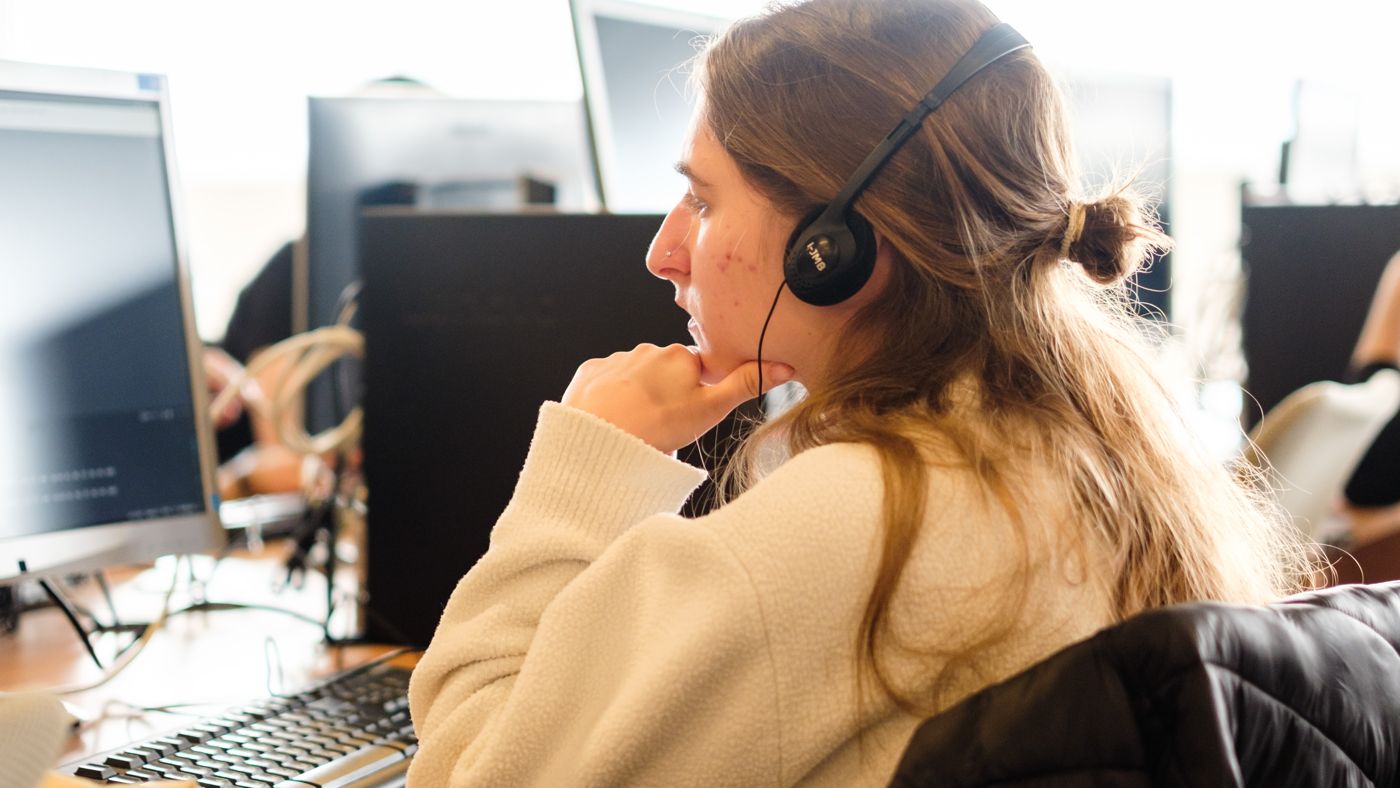 Two colleagues reviewing work together at a screen on the A³ campus
