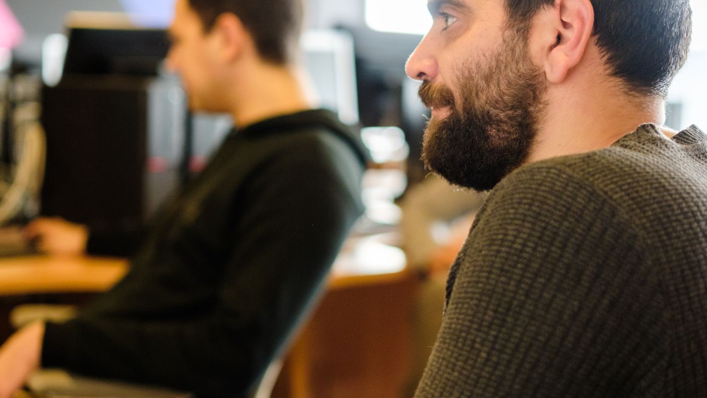 A discussion between colleagues on the A³ campus